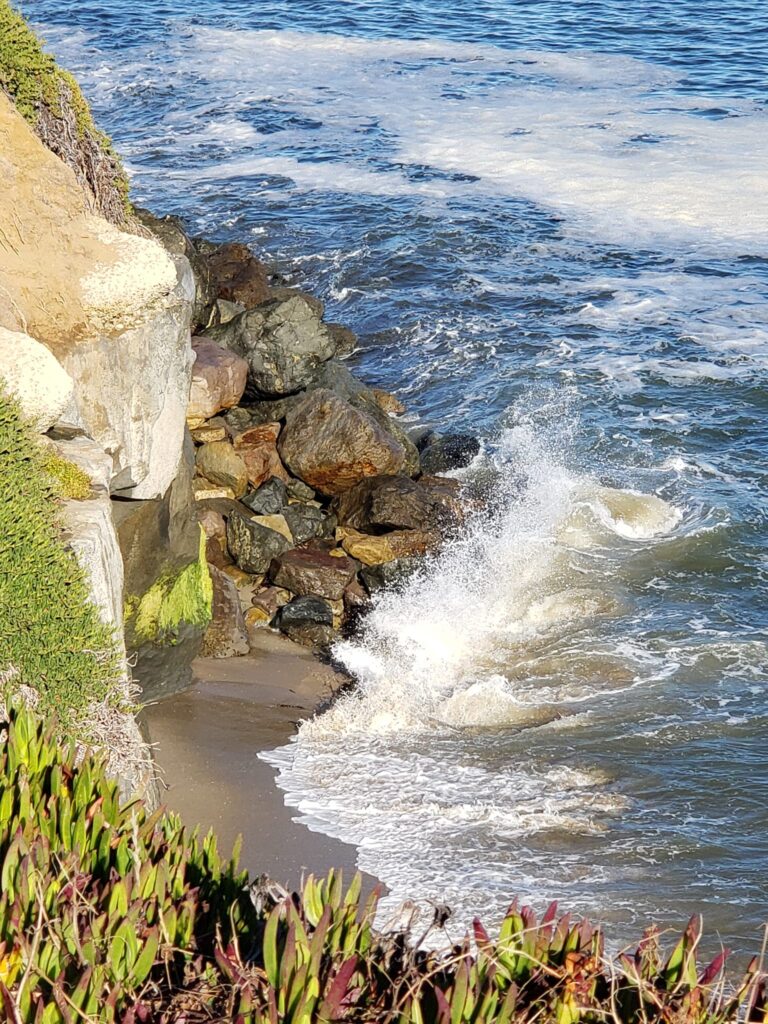 The tumoil of the waves against the rocks look beautiful, but turmoil of acid reflux is not.